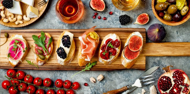 appetizerstablewithitalianantipastisnacksandwineinglasses-2