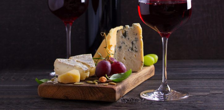 glassandbottleofwinewithcheesegrapesandnuts-3-2